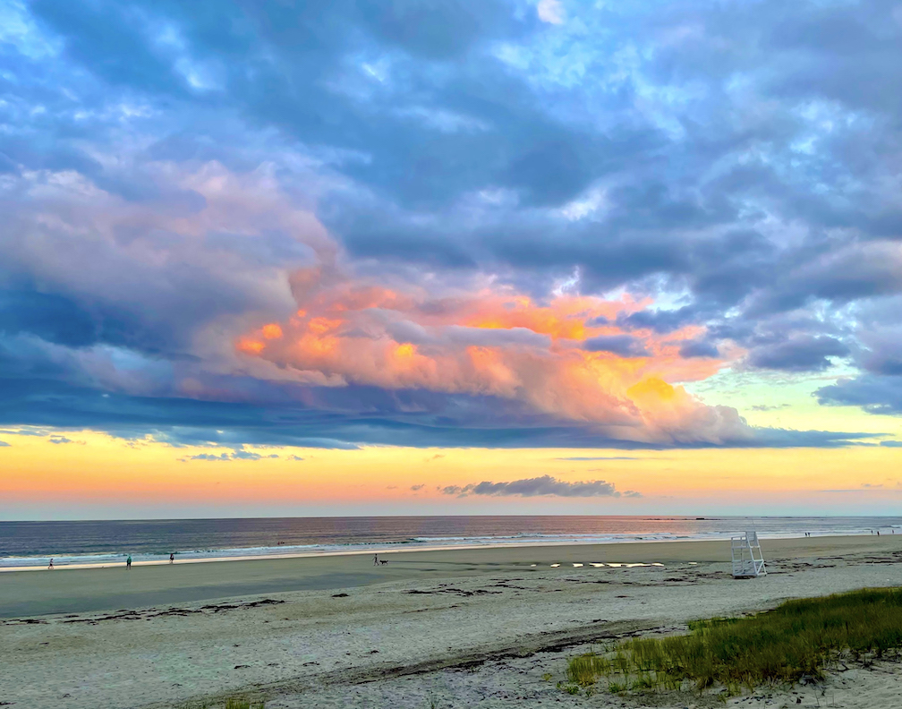 Late afternoon sun coloring clouds at Wells Beach, Maine